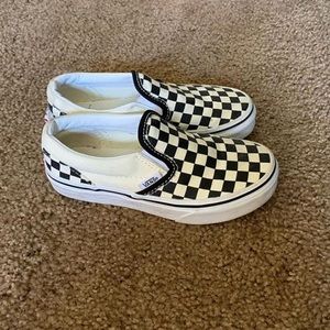 White and black checkered vans.